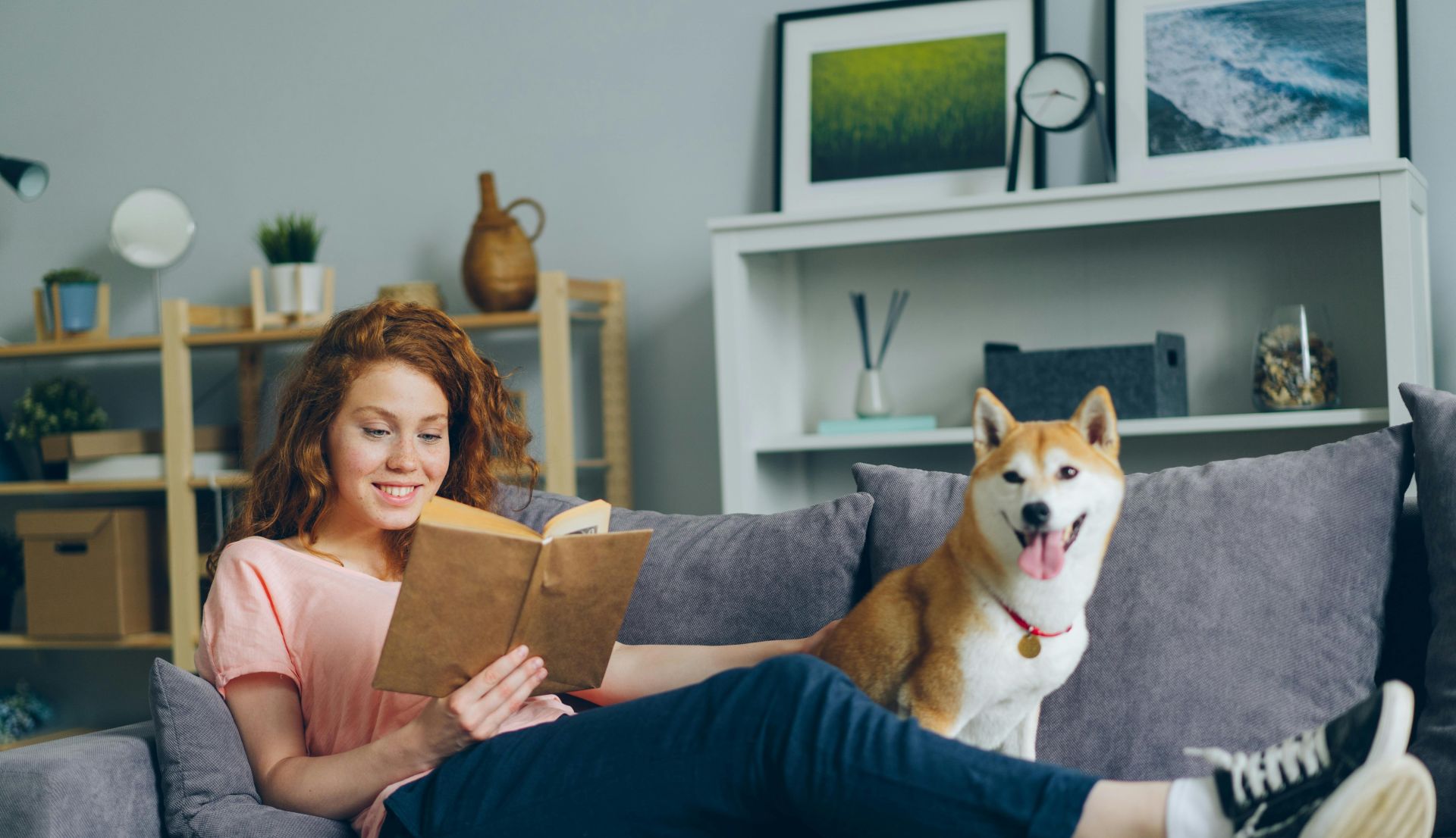 A Woman and a Dog on a Sofa